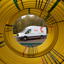 Cadent vehicle within yellow tubing spiral
