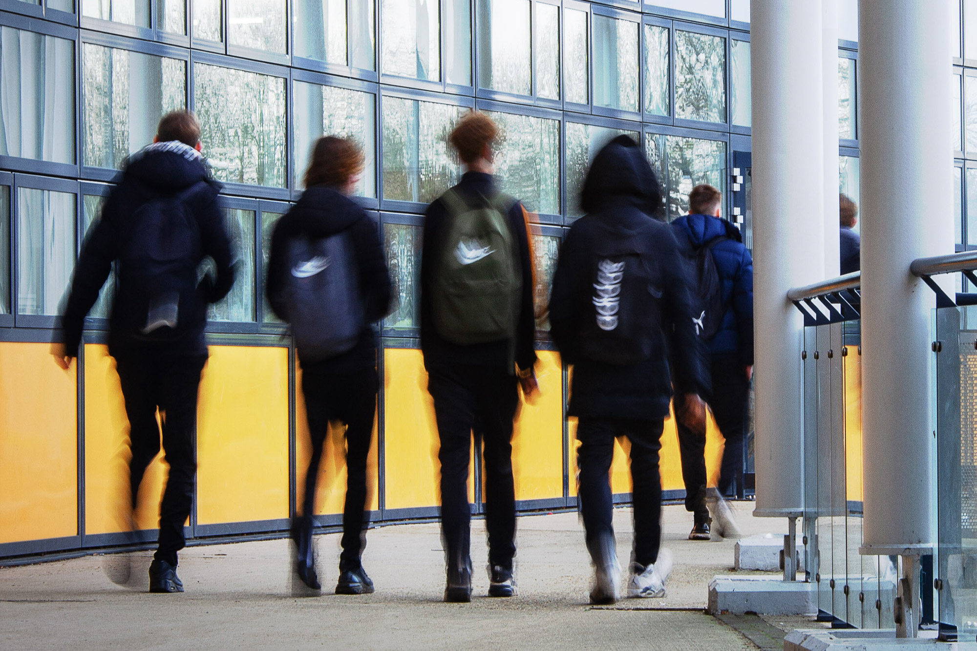 Vlurry image of teenagers in school uniform